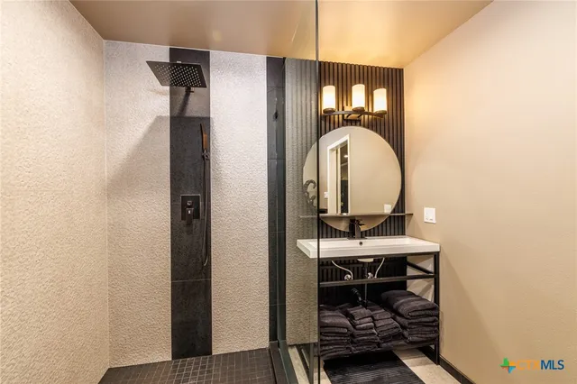 a bedroom with a bed window and couch