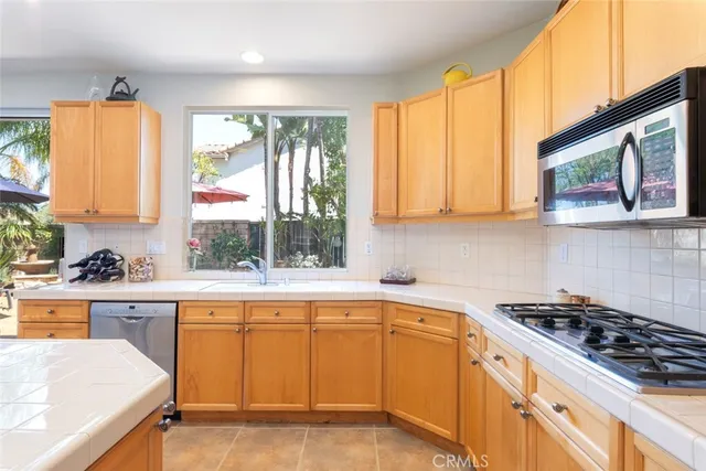 a view of a dining room with furniture and window
