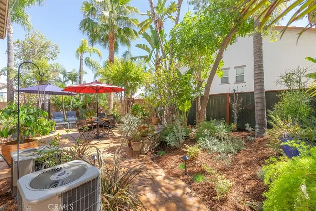 an outdoor space with patio and umbrella