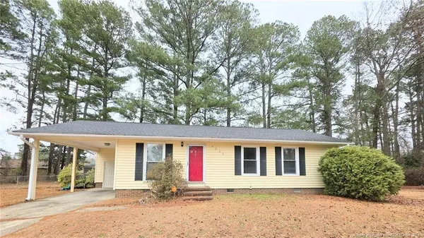 front view of a house with a garden