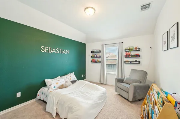 a bedroom with a bed and a couch