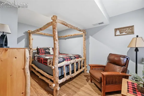 a bedroom with furniture and a window