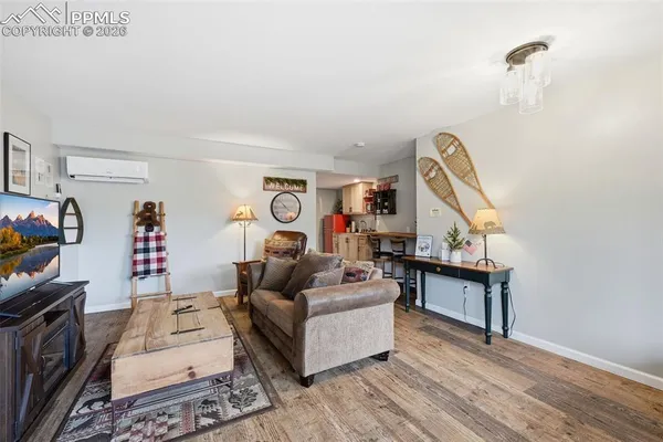a living room with furniture and a flat screen tv