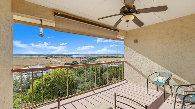 a view of a balcony with wooden floor