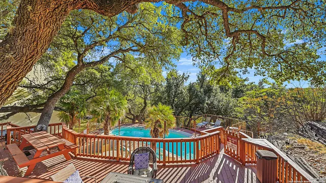 a view of a backyard with wooden fence
