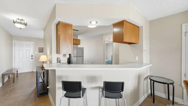 a view of kitchen with furniture and wooden floor