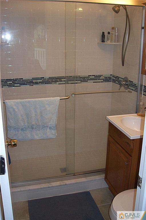 23 Rodney Road East Brunswick, NJ 08816 - Photo 12 of 25 a bathroom with a sink a toilet and shower