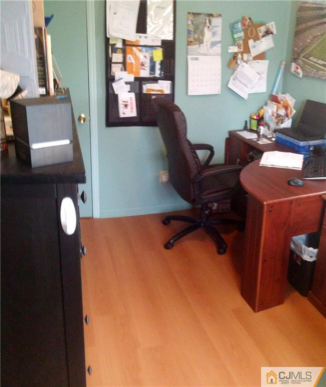 23 Rodney Road East Brunswick, NJ 08816 - Photo 20 of 25 a view of a workspace with furniture and a lamp