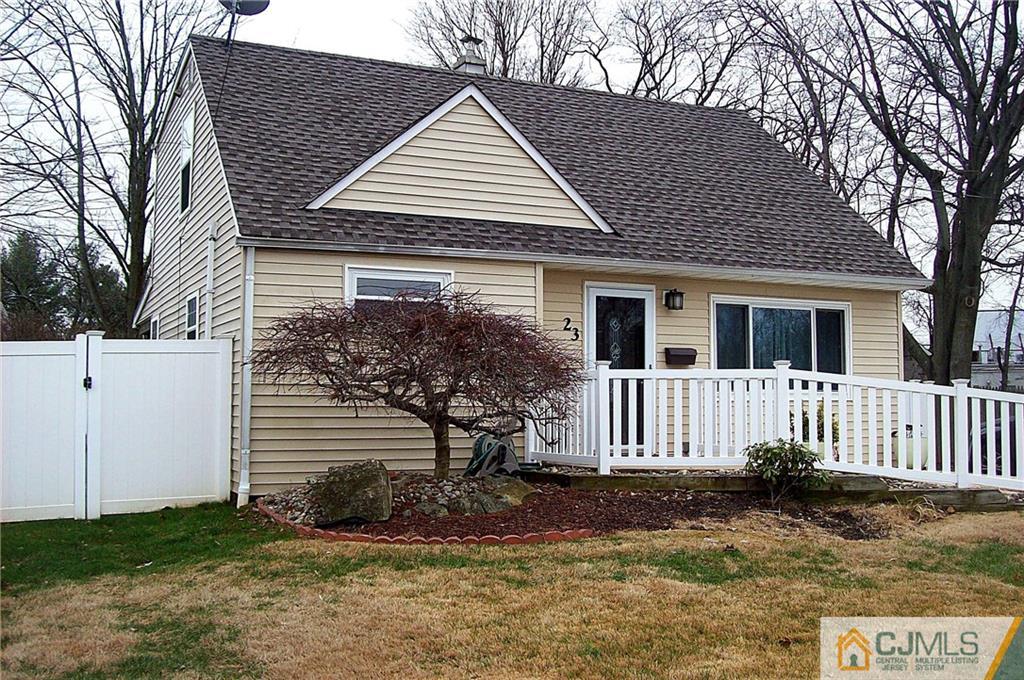 23 Rodney Road East Brunswick, NJ 08816 - Photo 3 of 25 a front view of a house with a garden