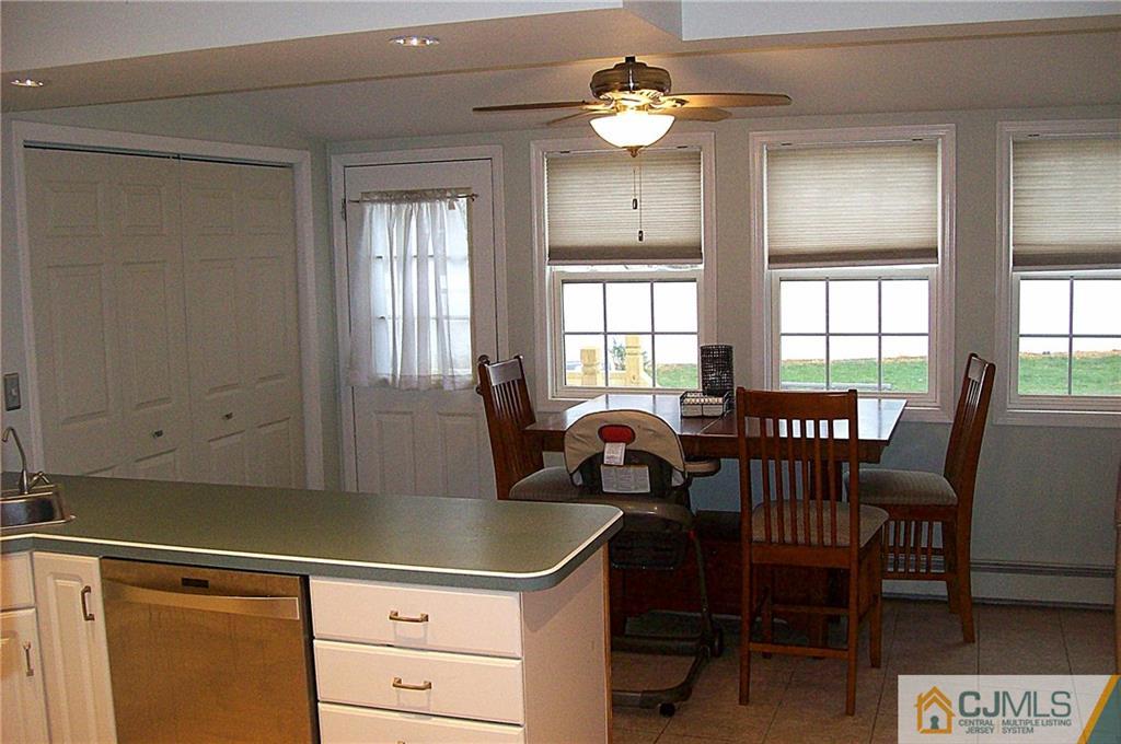 23 Rodney Road East Brunswick, NJ 08816 - Photo 9 of 25 a view of a dining room with furniture a chandelier and wooden floor