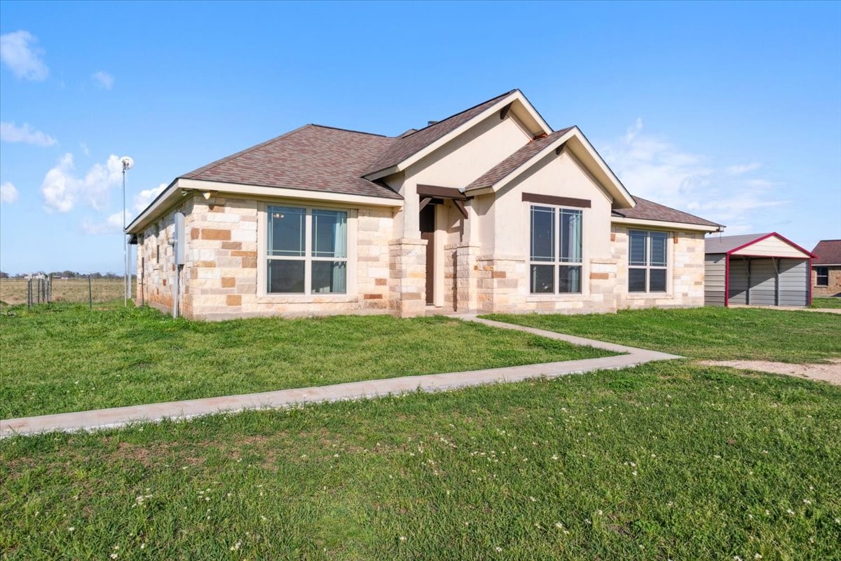 a front view of a house with a yard
