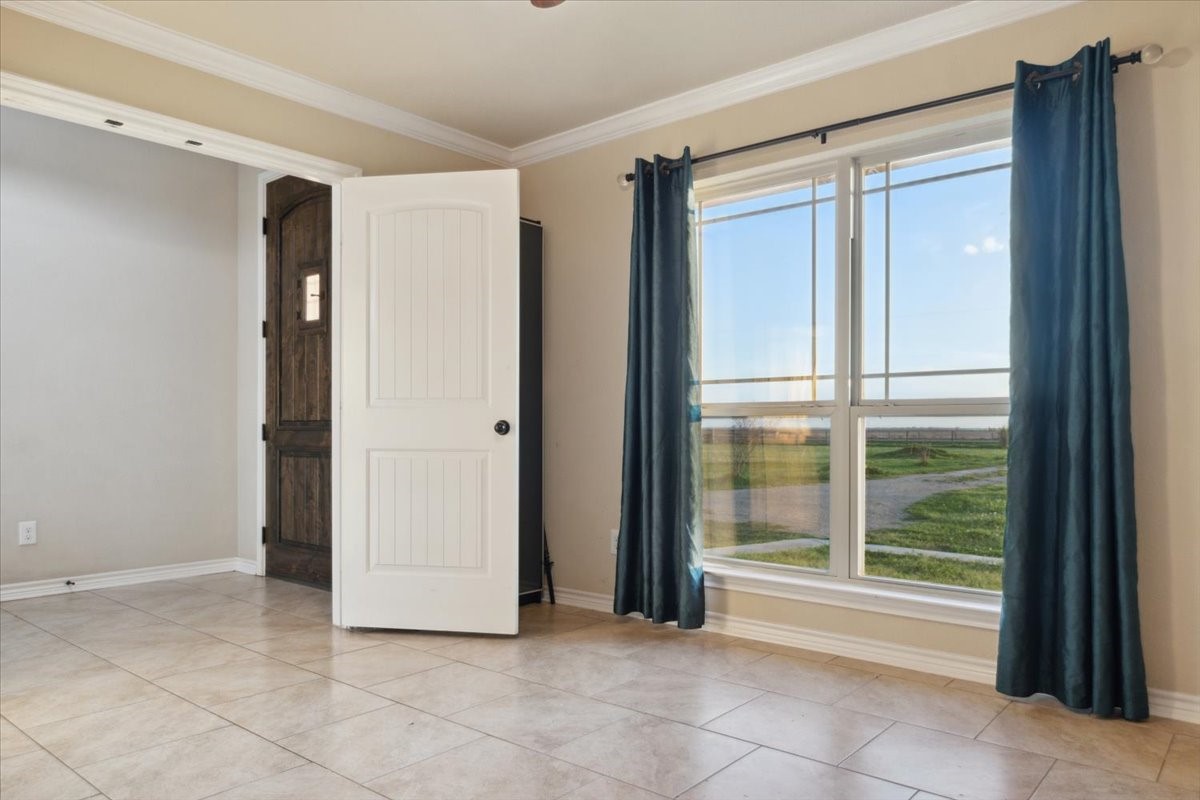 2407 Thuesen Road Beasley, TX 77417 - Photo 11 of 34 a view of an empty room with a window