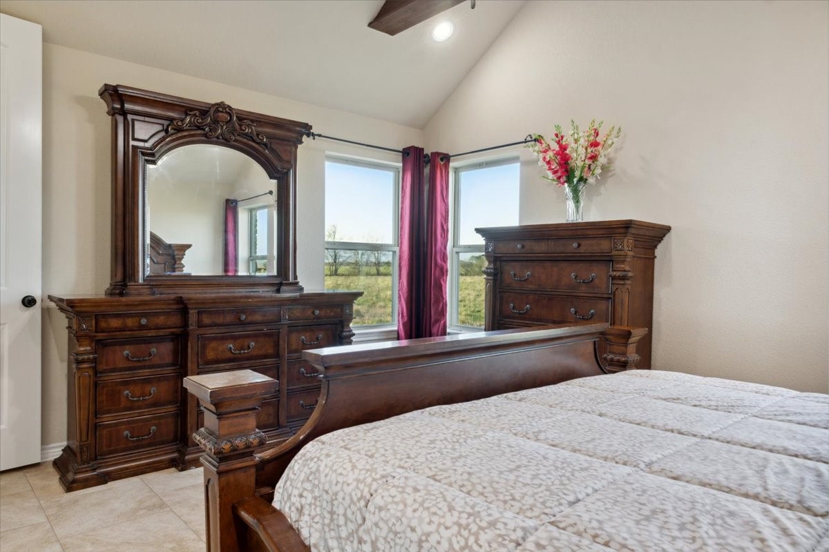 2407 Thuesen Road Beasley, TX 77417 - Photo 18 of 34 a bedroom with a bed and a dresser