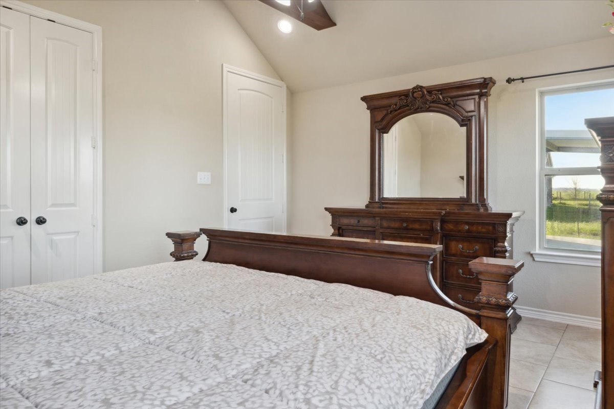 2407 Thuesen Road Beasley, TX 77417 - Photo 19 of 34 a bedroom with a bed and a dresser