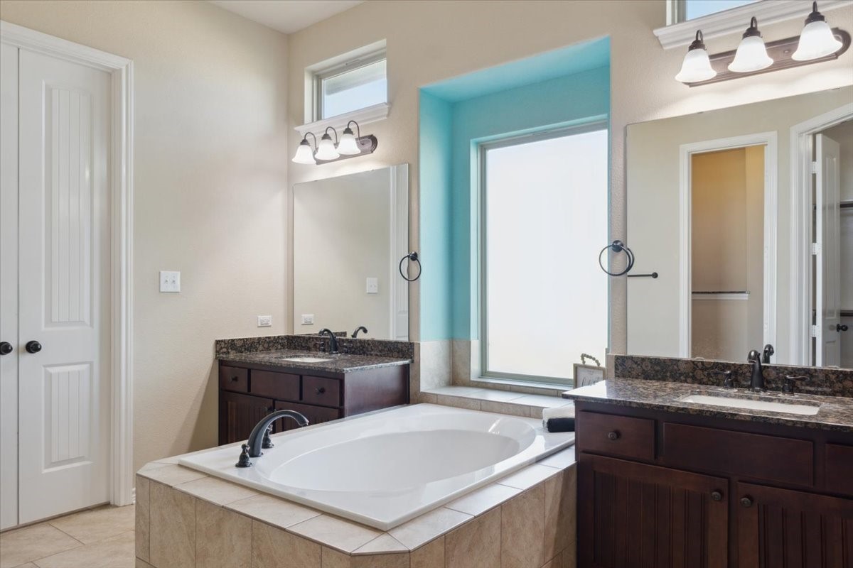 2407 Thuesen Road Beasley, TX 77417 - Photo 22 of 34 a bathroom with a sink and a mirror