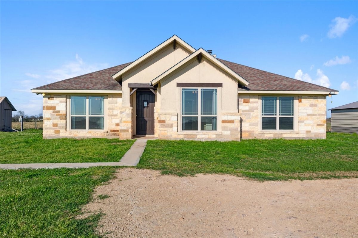 2407 Thuesen Road Beasley, TX 77417 - Photo 34 of 34 a front view of a house with a yard