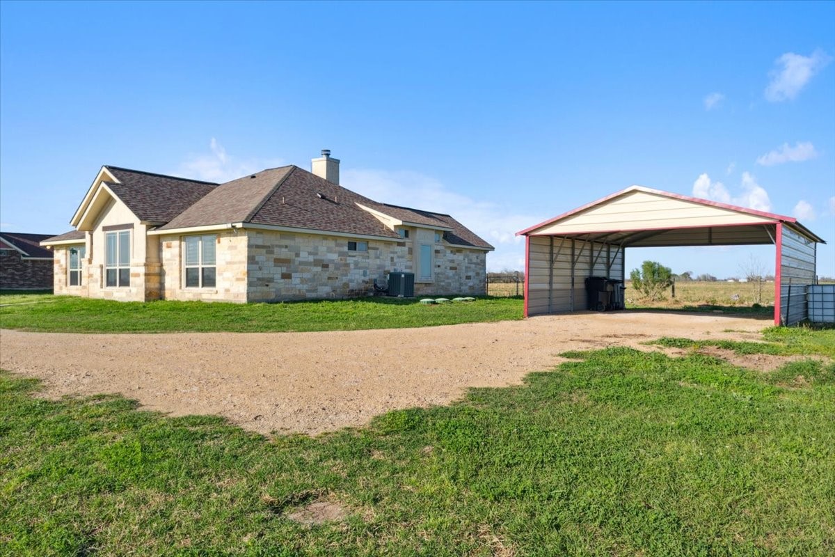 2407 Thuesen Road Beasley, TX 77417 - Photo 6 of 34 a house with green field in front of it