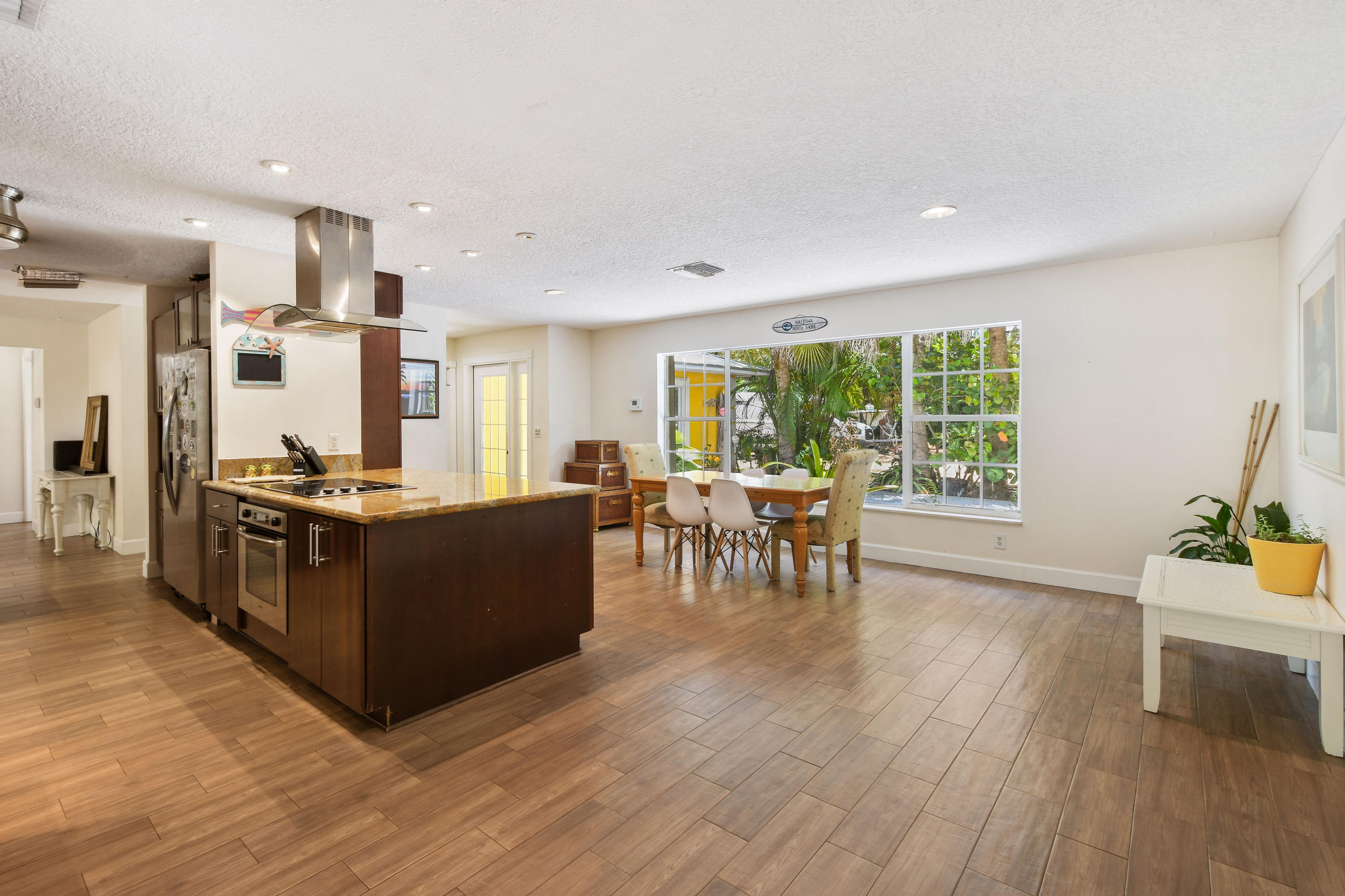 19943 Pinetree Drive Jupiter, FL 33469 - Photo 13 of 42 a living room with furniture and a wooden floor