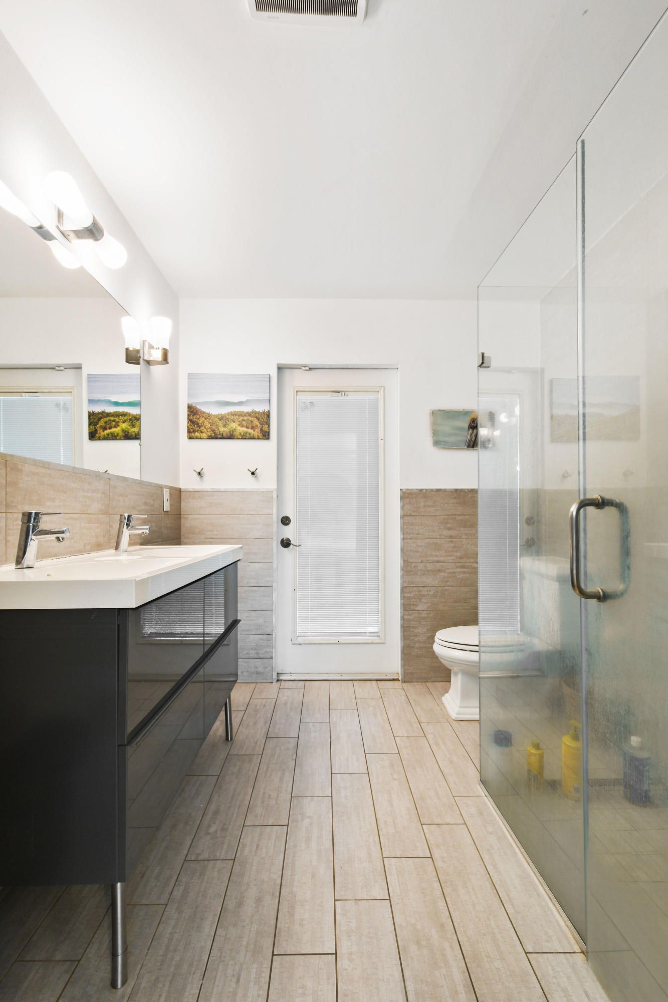 19943 Pinetree Drive Jupiter, FL 33469 - Photo 19 of 42 a bathroom with a sink a toilet and shower