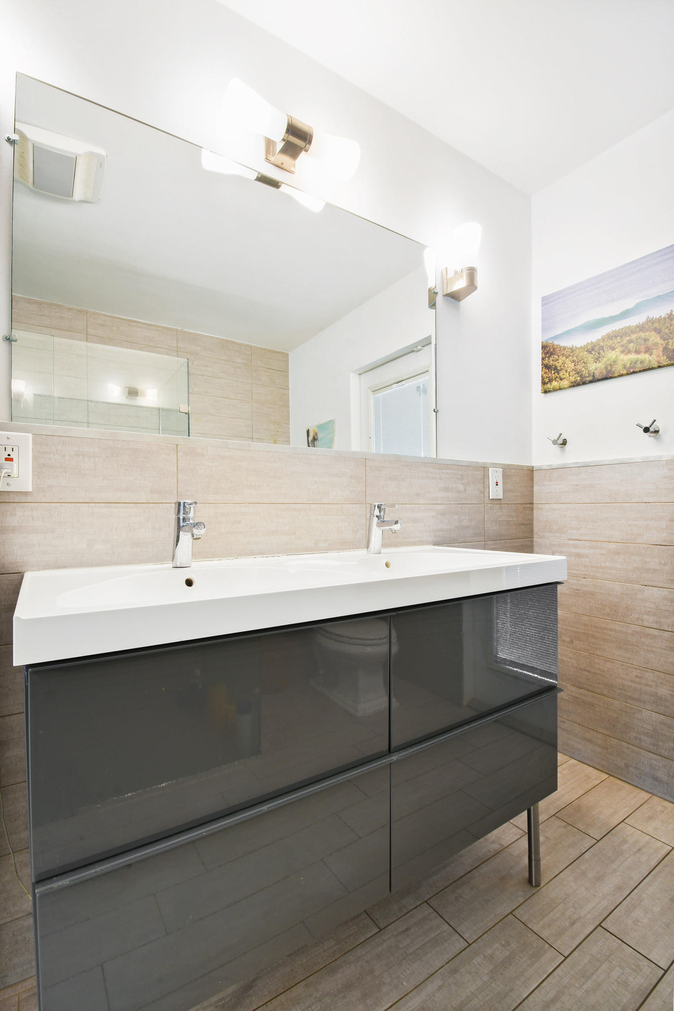 19943 Pinetree Drive Jupiter, FL 33469 - Photo 20 of 42 a bathroom with a sink and a mirror