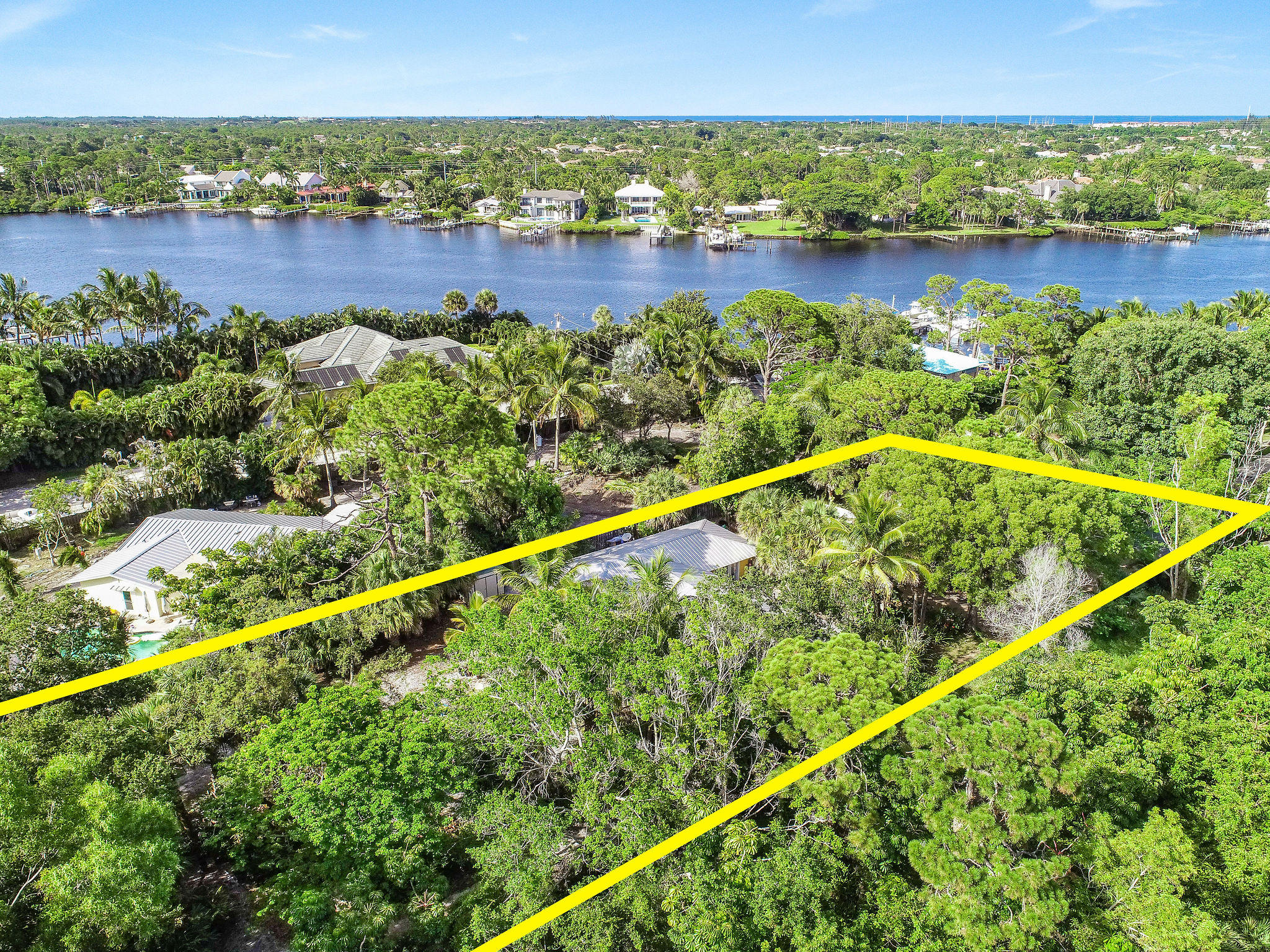 19943 Pinetree Drive Jupiter, FL 33469 - Photo 2 of 42 a view of a city and lake