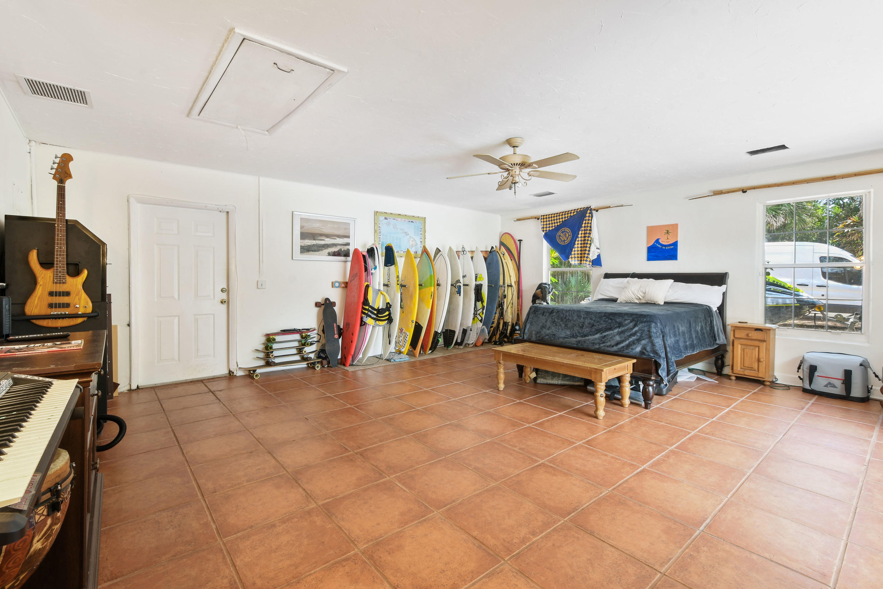 19943 Pinetree Drive Jupiter, FL 33469 - Photo 25 of 42 a living room with furniture and a flat screen tv