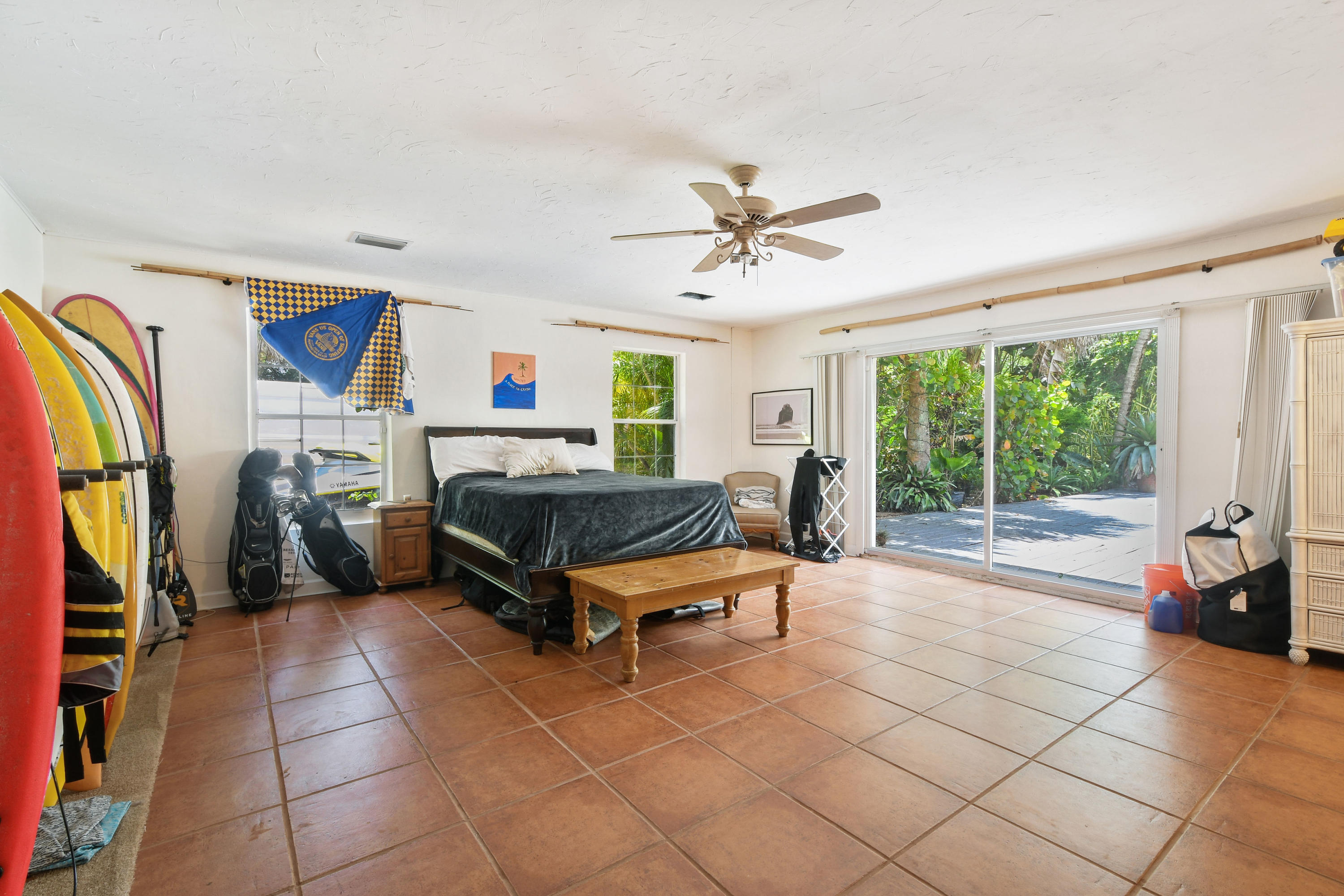 19943 Pinetree Drive Jupiter, FL 33469 - Photo 26 of 42 a living room with furniture and a flat screen tv