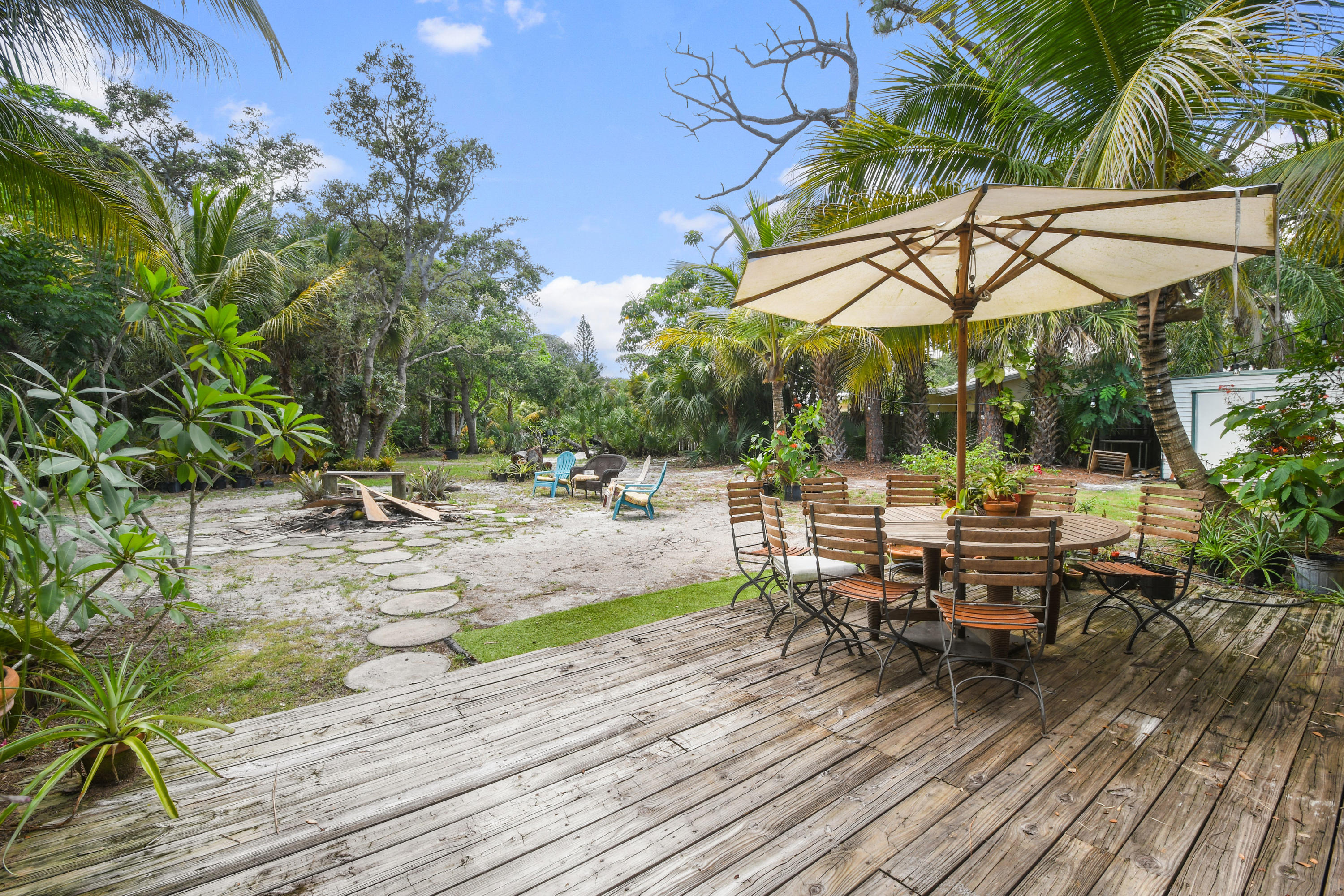 19943 Pinetree Drive Jupiter, FL 33469 - Photo 28 of 42 a view of backyard with sitting area