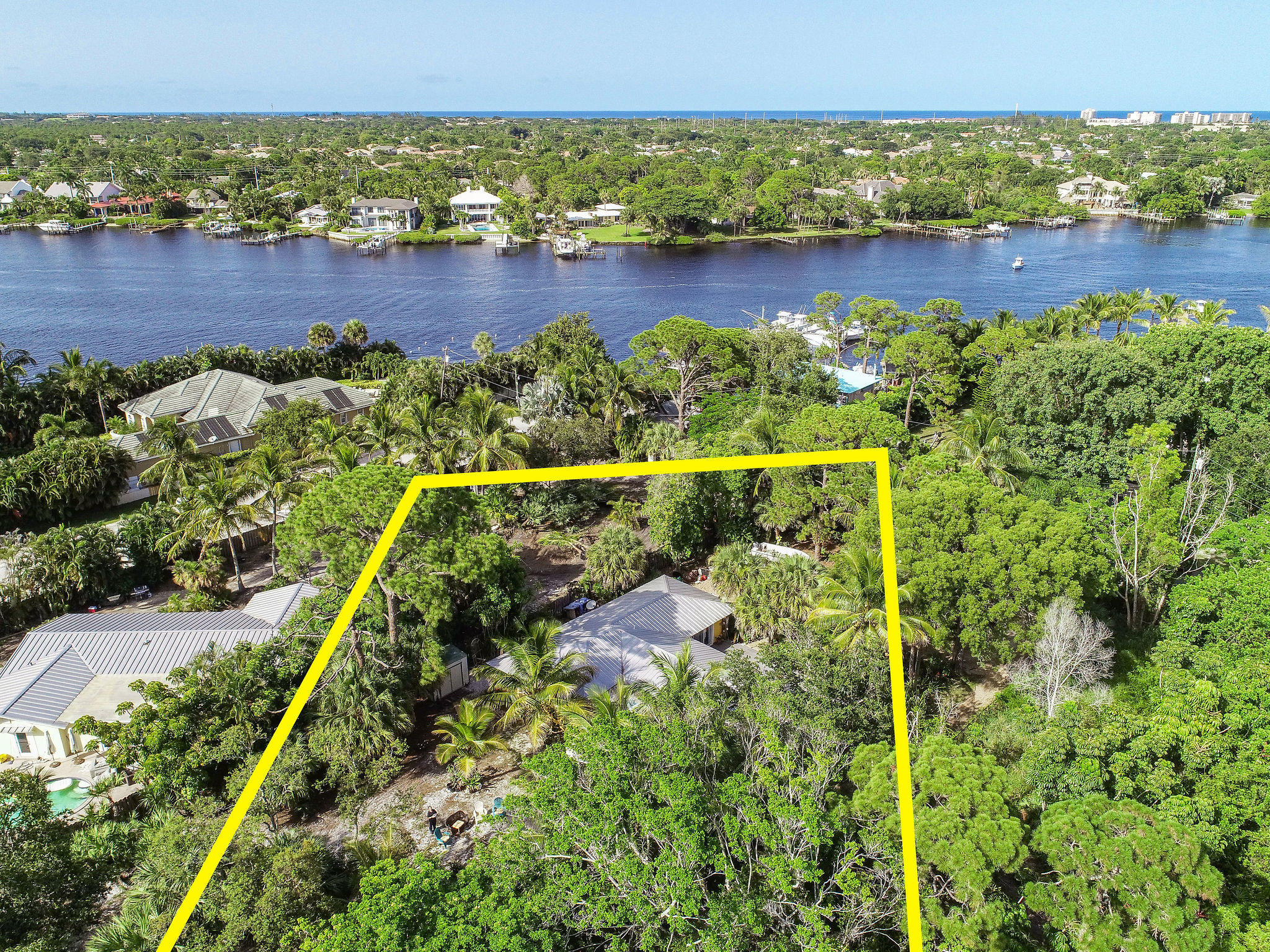 19943 Pinetree Drive Jupiter, FL 33469 - Photo 37 of 42 an aerial view of residential houses with outdoor space and lake view