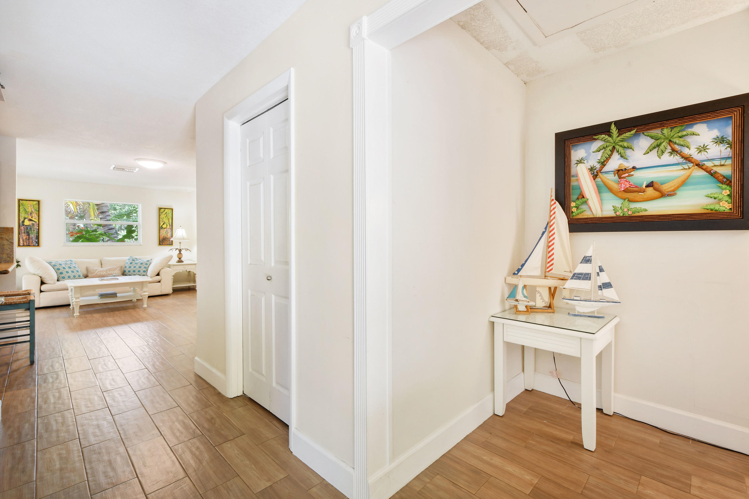 19943 Pinetree Drive Jupiter, FL 33469 - Photo 5 of 42 a view of a livingroom with furniture and wooden floor