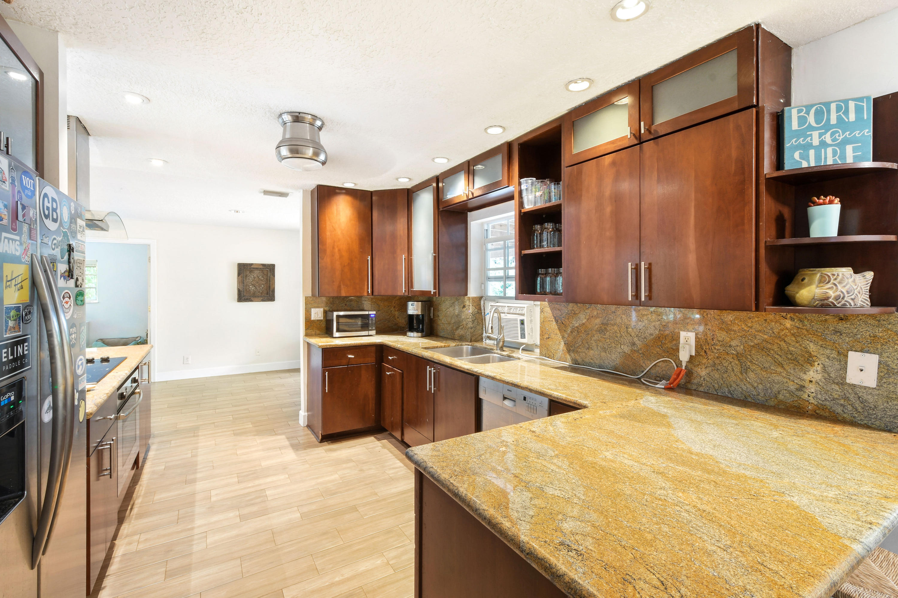 19943 Pinetree Drive Jupiter, FL 33469 - Photo 8 of 42 a spacious bathroom with a granite countertop sink and a bathtub