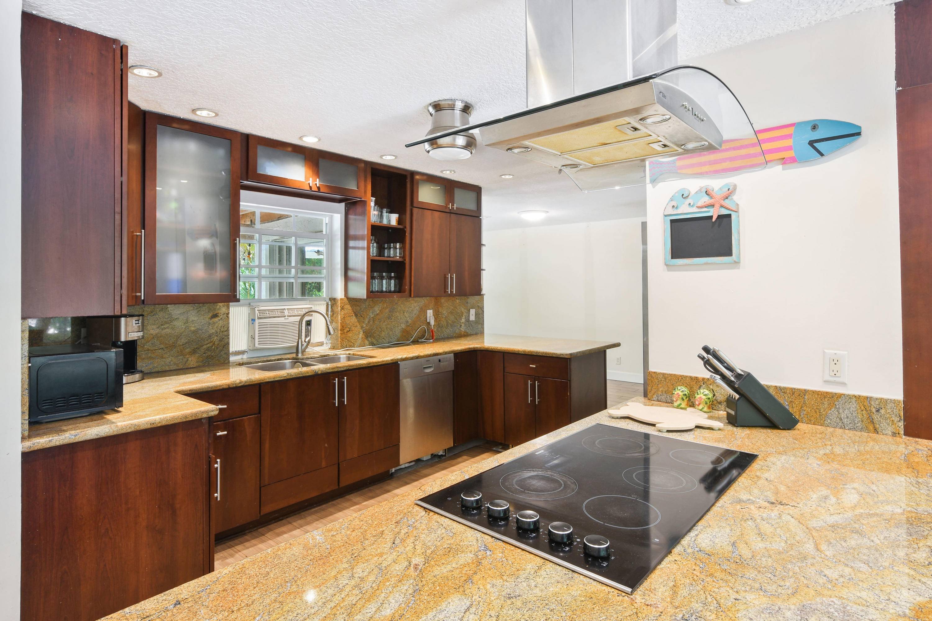 19943 Pinetree Drive Jupiter, FL 33469 - Photo 10 of 42 a bedroom with a bed and window