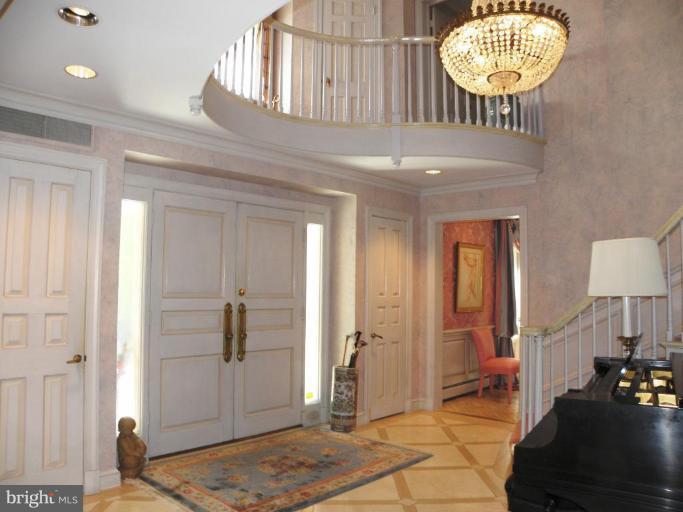 7004 Nevis Road Bethesda, MD 20817 - Photo 2 of 24 a view of a hallway with a mirror and a window