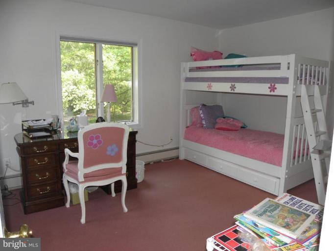 7004 Nevis Road Bethesda, MD 20817 - Photo 15 of 24 a bedroom with a bed and a closet