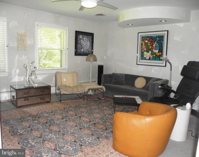 7004 Nevis Road Bethesda, MD 20817 - Photo 16 of 24 a living room with furniture and a window