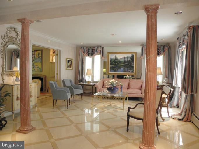 7004 Nevis Road Bethesda, MD 20817 - Photo 3 of 24 a living room with furniture and a fireplace