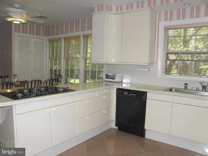 7004 Nevis Road Bethesda, MD 20817 - Photo 6 of 24 a kitchen with a sink and cabinets