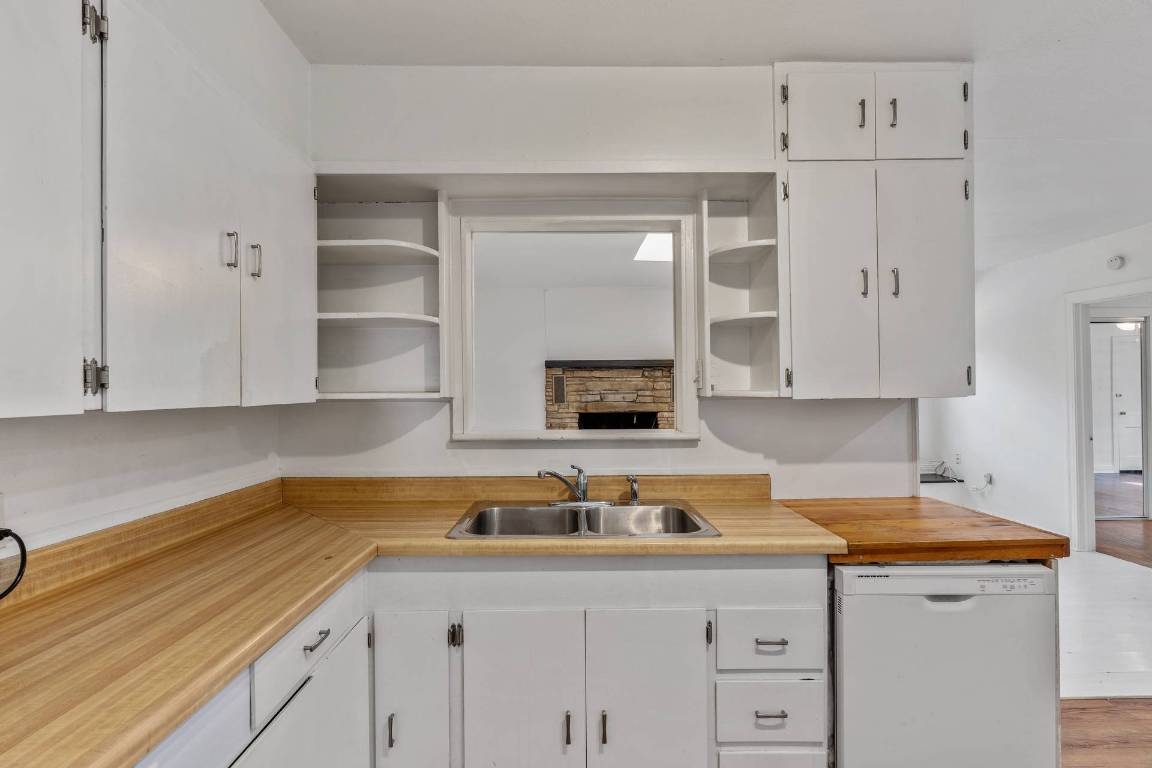 406 East Monroe Street, Unit B Austin, TX 78704 - Photo 11 of 35 a kitchen with a sink and cabinets