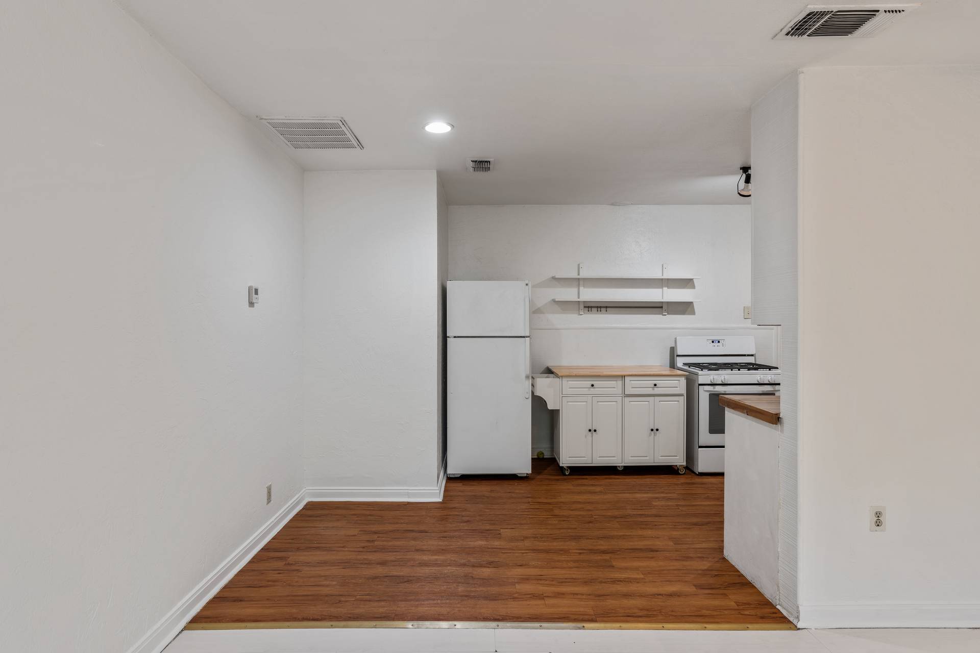 406 East Monroe Street, Unit B Austin, TX 78704 - Photo 12 of 35 a view of a kitchen with stove and refrigerator