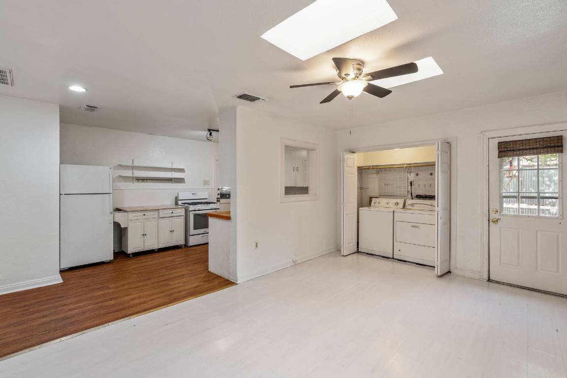 406 East Monroe Street, Unit B Austin, TX 78704 - Photo 13 of 35 a view of a kitchen with a sink and a refrigerator