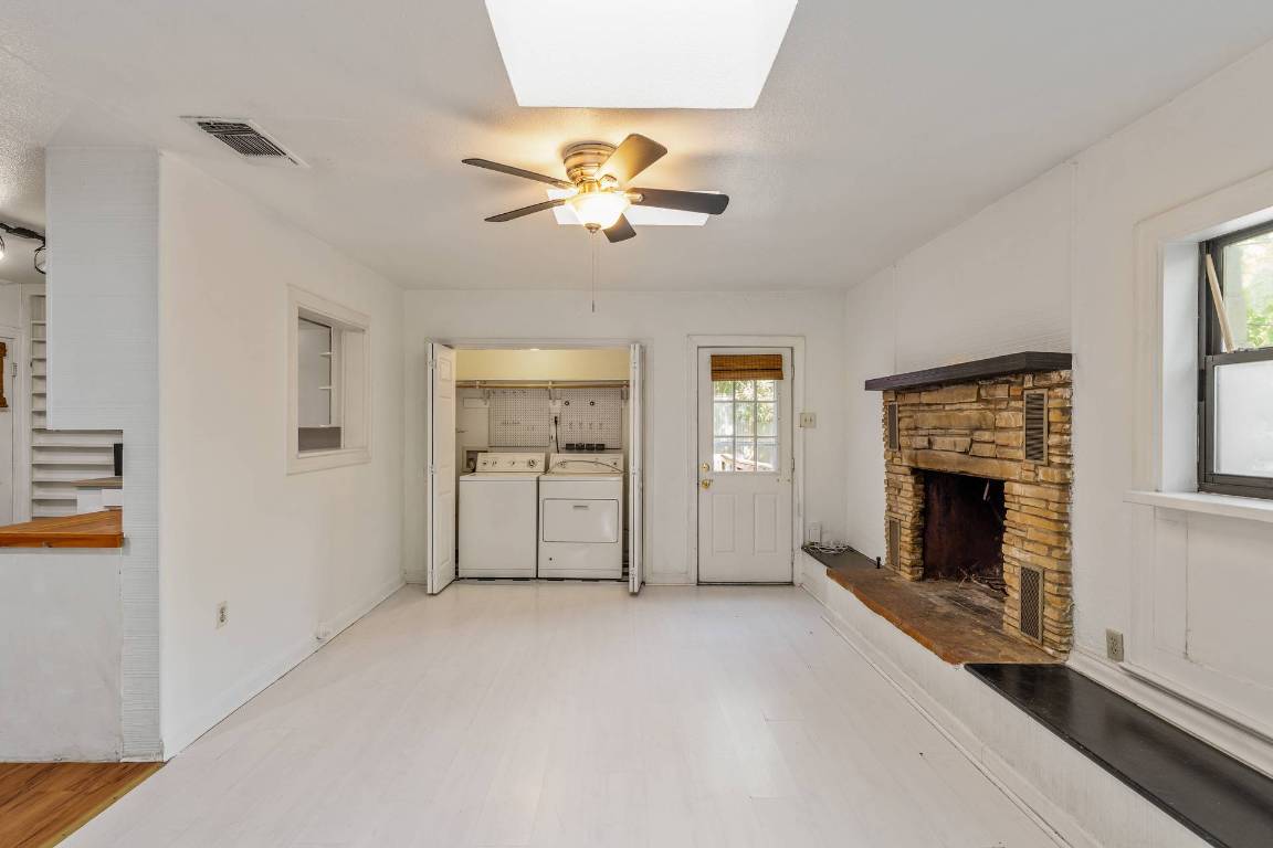 406 East Monroe Street, Unit B Austin, TX 78704 - Photo 15 of 35 a view of empty room with a fireplace and fan