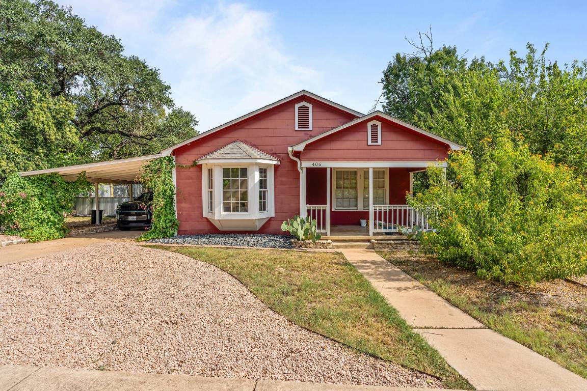 406 East Monroe Street, Unit B Austin, TX 78704 - Photo 2 of 35 a front view of a house with garden