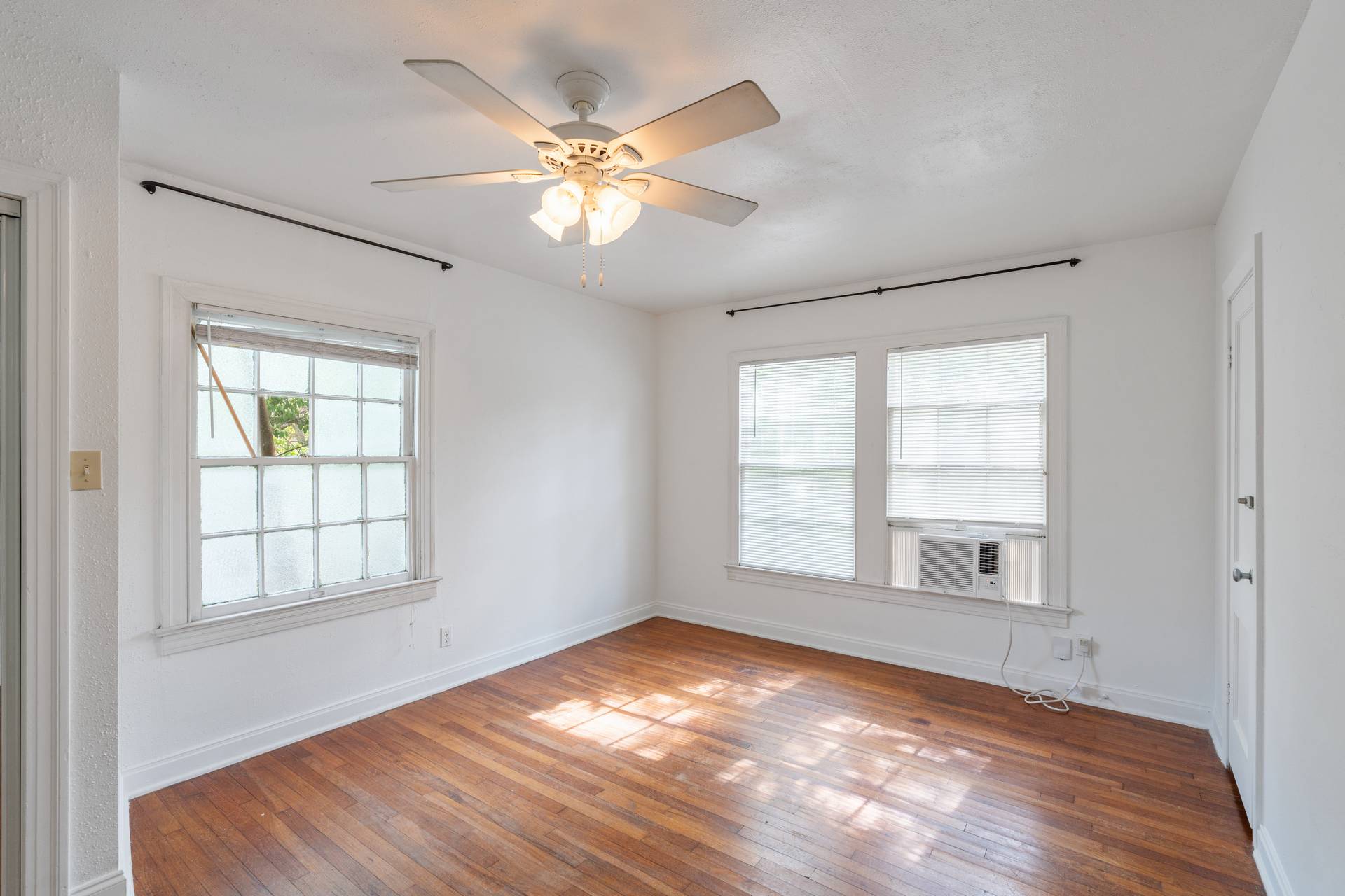 406 East Monroe Street, Unit B Austin, TX 78704 - Photo 23 of 35 a view of empty room with wooden floor and fan