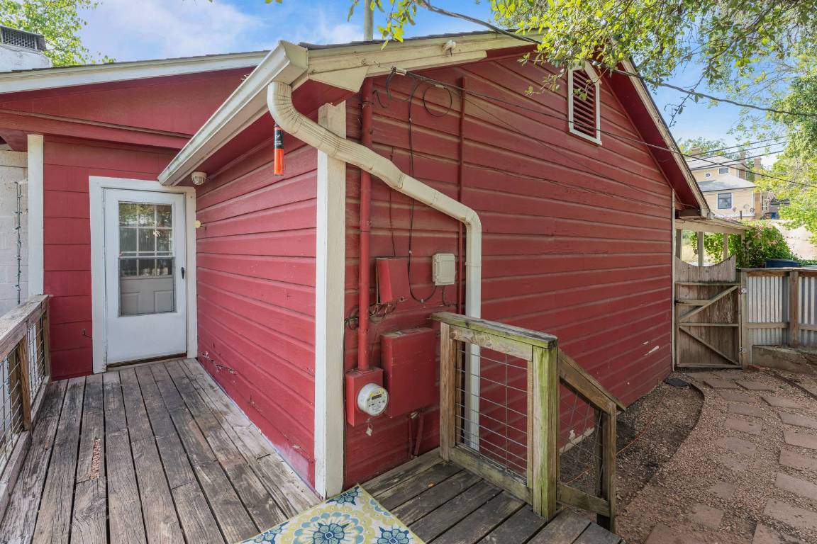 406 East Monroe Street, Unit B Austin, TX 78704 - Photo 29 of 35 View of side of property with a gate and a wooden deck