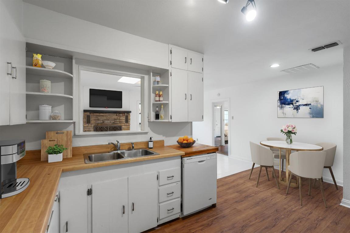 406 East Monroe Street, Unit B Austin, TX 78704 - Photo 4 of 35 a open kitchen with sink cabinets and wooden floor