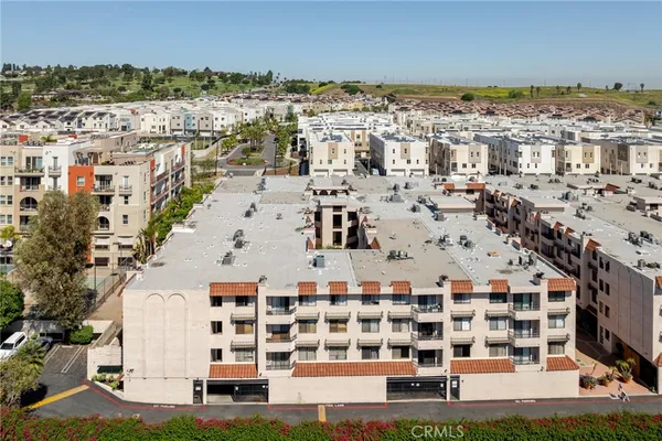 a view of building with parking space