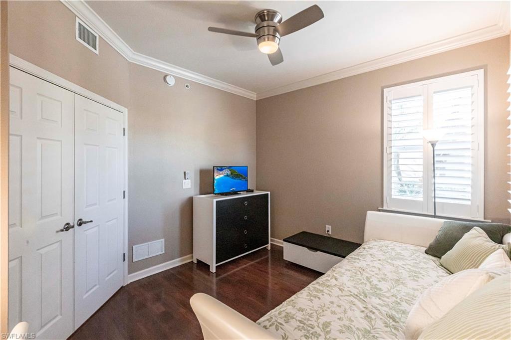 9508 Ironstone Terrace, Unit 2102 Naples, FL 34120 - Photo 26 of 50 a bedroom with a bed and a window