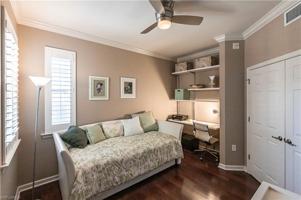9508 Ironstone Terrace, Unit 2102 Naples, FL 34120 - Photo 27 of 50 a living room with furniture and a window