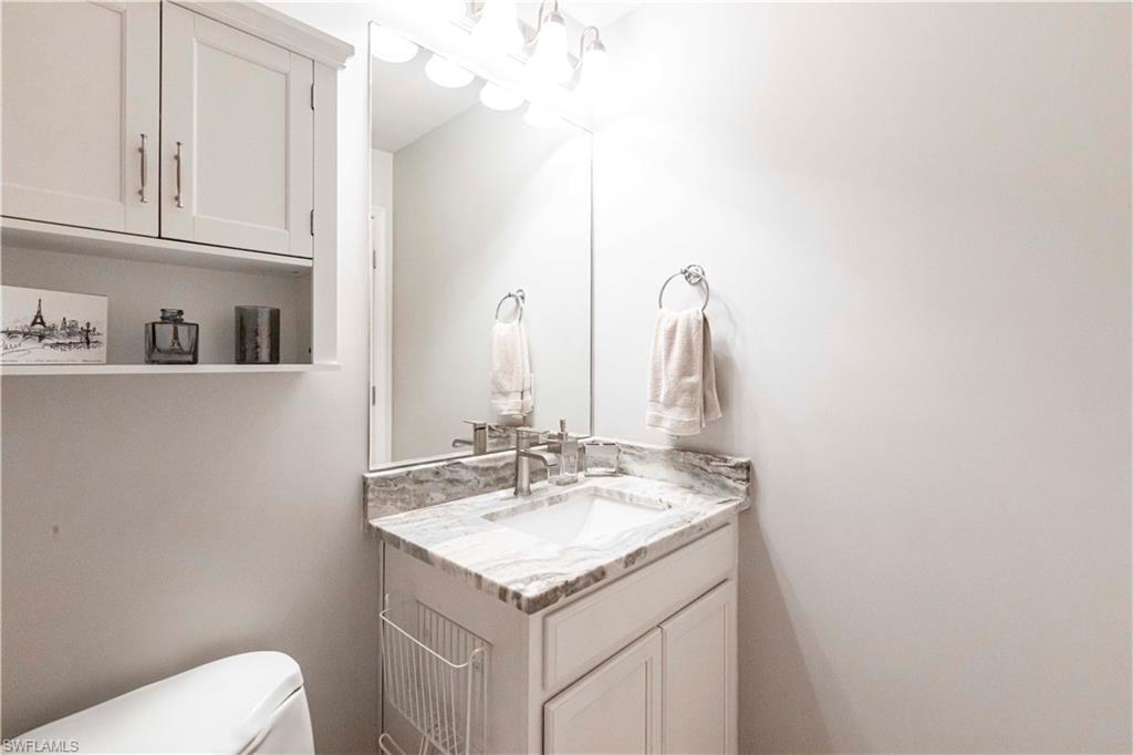 9508 Ironstone Terrace, Unit 2102 Naples, FL 34120 - Photo 28 of 50 a bathroom with a sink and a toilet