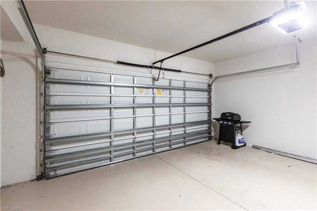 9508 Ironstone Terrace, Unit 2102 Naples, FL 34120 - Photo 35 of 50 a view of a garage